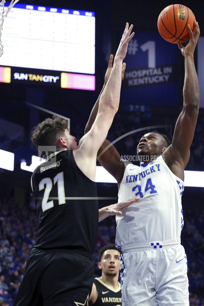 James Crisp Kentucky's Oscar Tshiebwe (34) shoots while defended by Vanderbilt's Liam Robbins (21) during the first half of an NCAA college basketball game in Lexington, Ky., Wednesday, Feb. 2, 2022. (AP Photo/James Crisp)