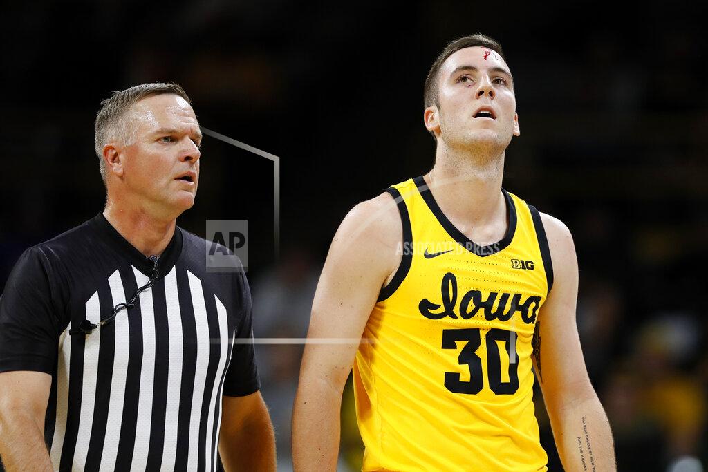 Charlie Neibergall Iowa guard Connor McCaffery (30) walks to the bench after being injured during the first half of an NCAA college basketball game against DePaul, Monday, Nov. 11, 2019, in Iowa City, Iowa.(AP Photo/Charlie Neibergall)