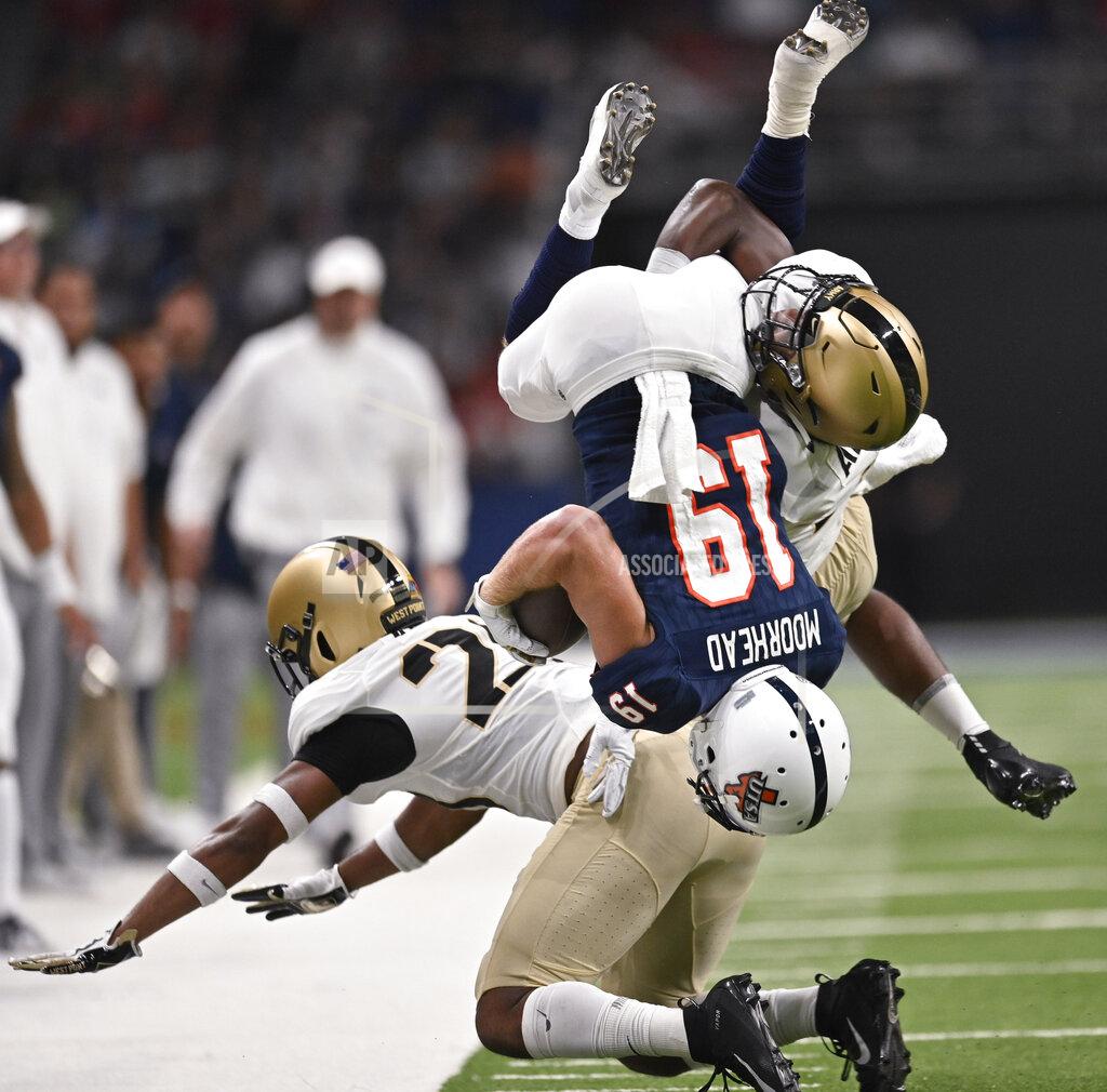 Darren Abate UTSA's Blaze Moorhead (19) is tackled by Army's Cedrick Cunningham, Jr., right, and Cam Jones during the first half of an NCAA college football game Saturday, Sept. 14, 2019, in San Antonio. (AP Photo/Darren Abate)