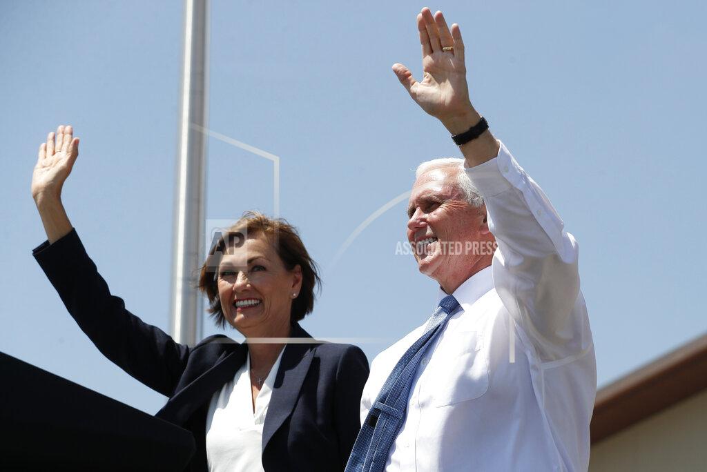 Charlie Neibergall Vice President Mike Pence waves with Iowa Gov. Kim Reynolds before speaking to workers at Winnebago Industries, Tuesday, June 16, 2020, in Forest City, Iowa. (AP Photo/Charlie Neibergall)