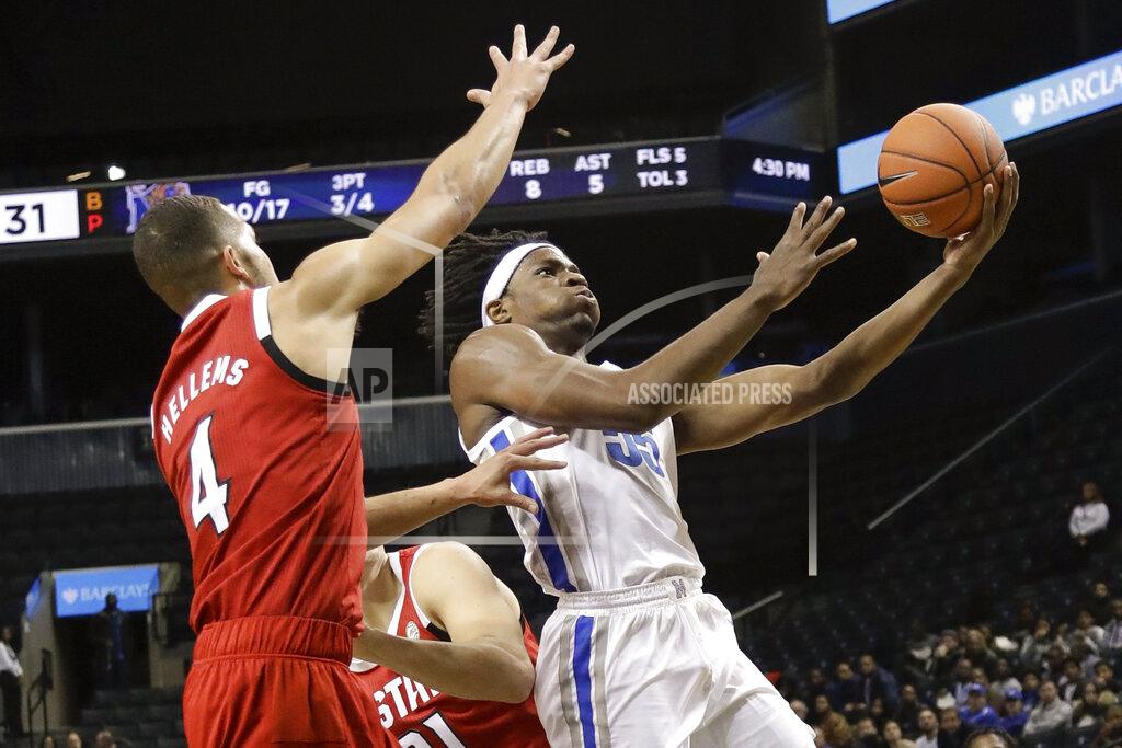 Frank Franklin Ii Memphis' Precious Achiuwa, right, drives past North Carolina State's Jericole Hellems during the first half of an NCAA college basketball game in the Barclays Classic, Thursday, Nov. 28, 2019, in New York. (AP Photo/Frank Franklin II)
