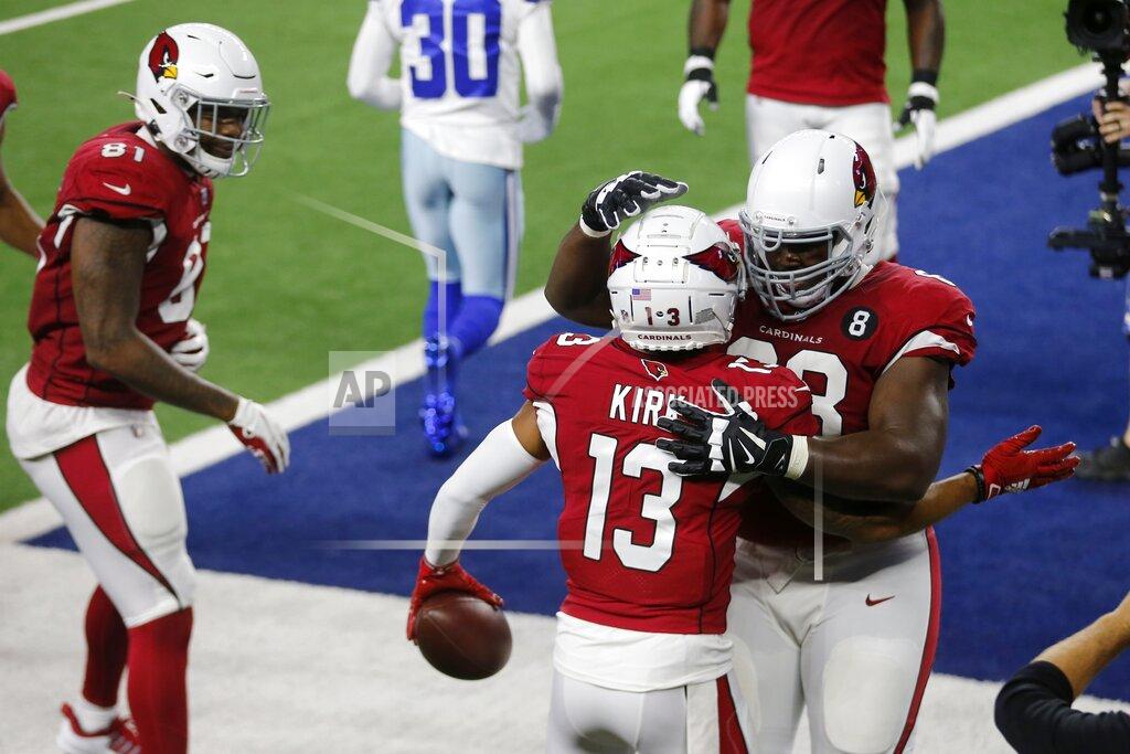 Michael Ainsworth Arizona Cardinals wide receiver Christian Kirk (13), Darrell Daniels (81) and Corey Peters, right, celebrate a touchdown scored by Kirk in the first half of an NFL football game against the Dallas Cowboys in Arlington, Texas, Monday, Oct. 19, 2020. (AP Photo/Michael Ainsworth)