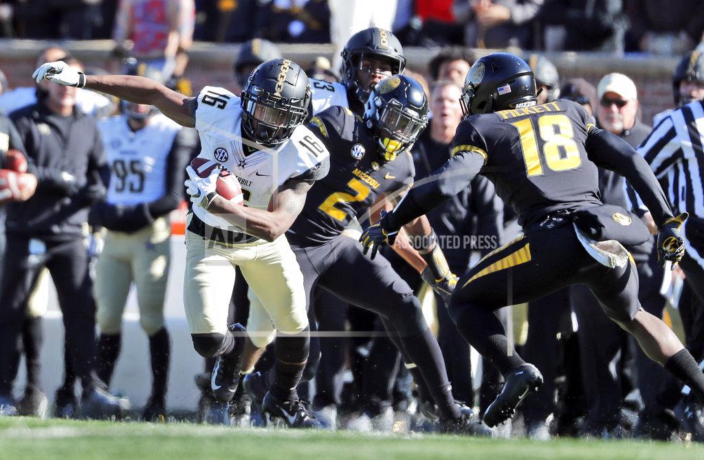 Jeff Roberson Vanderbilt wide receiver Kalija Lipscomb (16) runs with the ball as Missouri defensive back DeMarkus Acy (2) and safety Joshuah Bledsoe (18) defend during the first half of an NCAA college football game Saturday, Nov. 10, 2018, in Columbia, Mo. (AP Photo/Jeff Roberson)