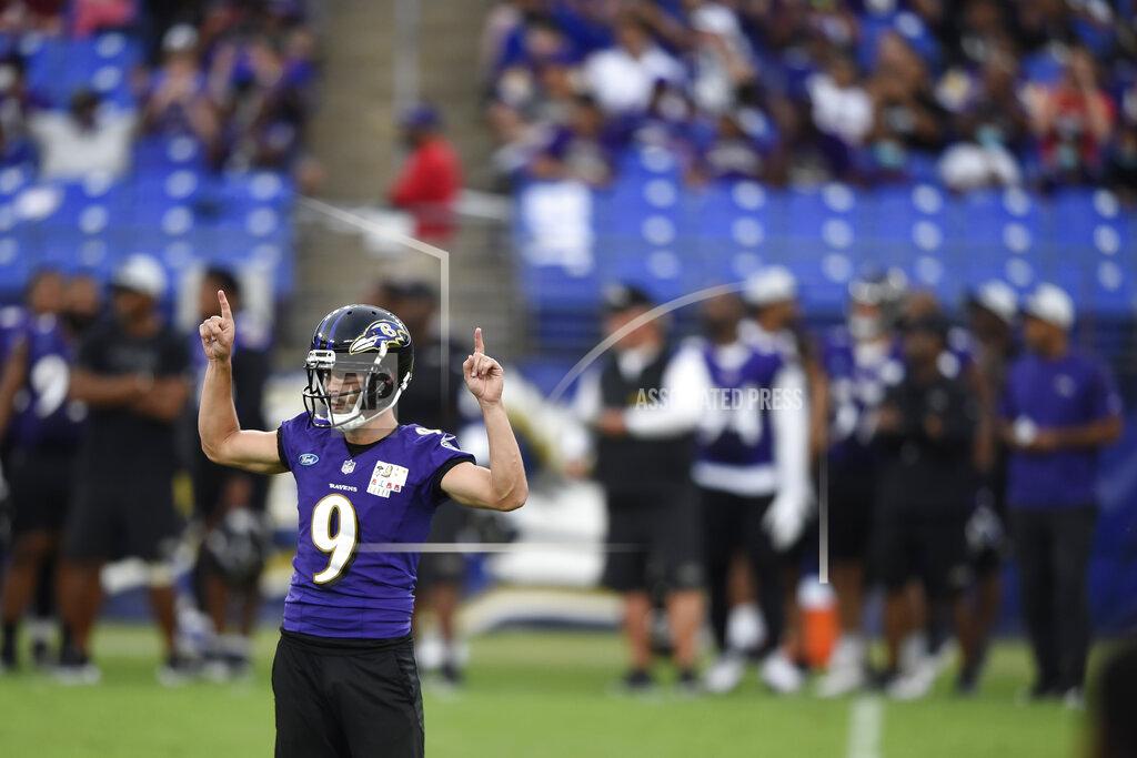 Gail Burton Baltimore Ravens kicker Justin Tucker reacts after booting a field goal during an NFL football training camp practice, Saturday, July 31, 2021, in Baltimore. (AP Photo/Gail Burton)