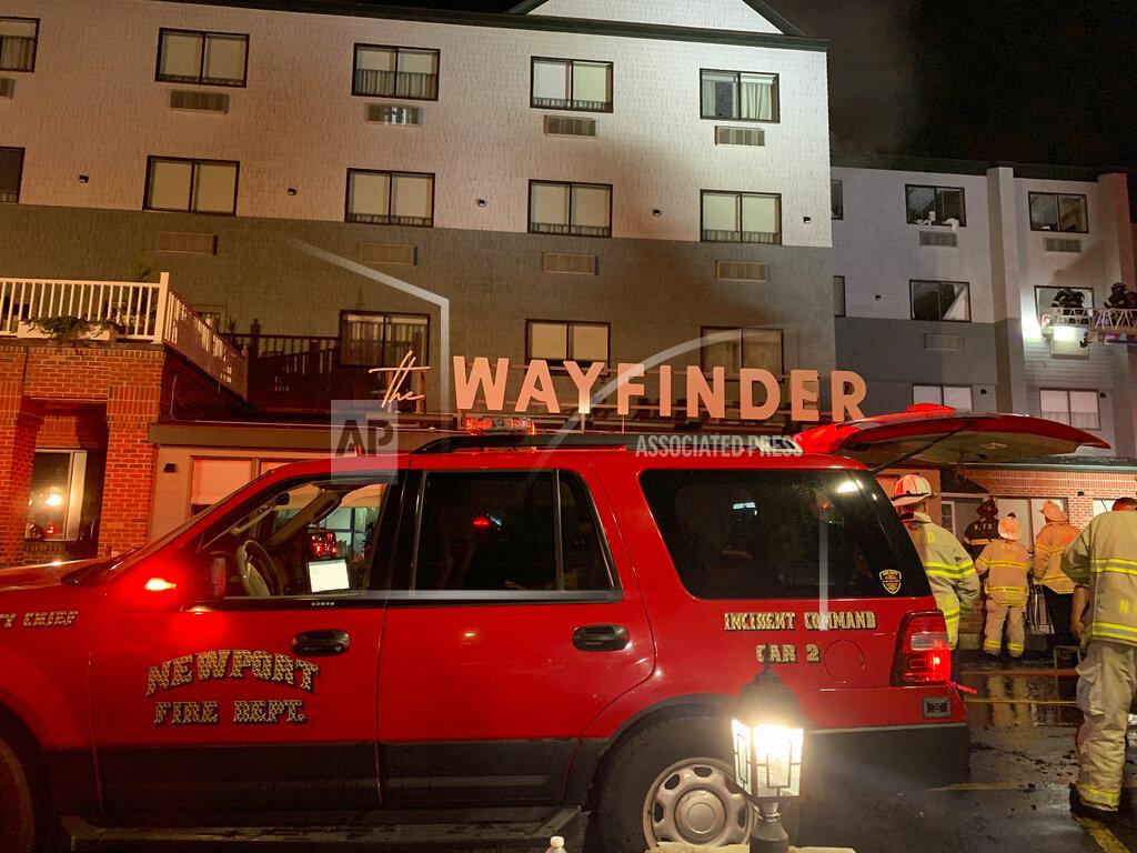 Scott Barrett Firefighters battle a fire at a recently renovated hotel in Newport, R.I., Monday, May 23, 2022. Three firefighters were injured battling the fire at the Wayfinder Hotel. (Scott Barrett/The Newport Daily News via AP)