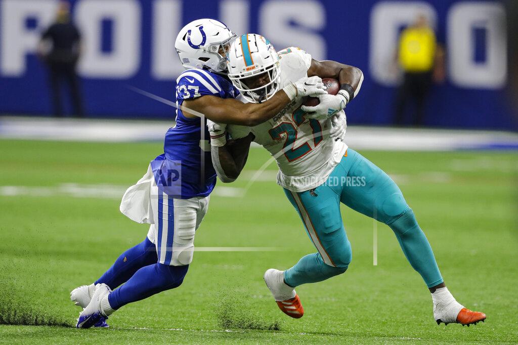 Darron Cummings Indianapolis Colts safety Khari Willis (37) tackles Miami Dolphins running back Kalen Ballage (27) during the second half of an NFL football game in Indianapolis, Sunday, Nov. 10, 2019. (AP Photo/Darron Cummings)
