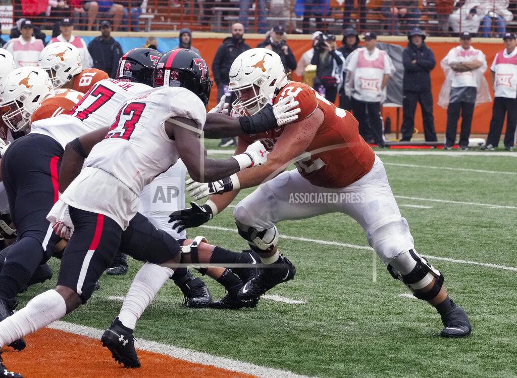 Michael Thomas FILE - In this Nov. 29, 2019, file photo, Texas lineman Sam Cosmi, right, blocks against Texas Tech's Tony Bradford, left, during an NCAA college football game in Austin, Texas. The Washington Football Team selected Cosmi on Friday, April 30, 2021, with the 51st pick in the draft. (AP Photo/Michael Thomas, File)