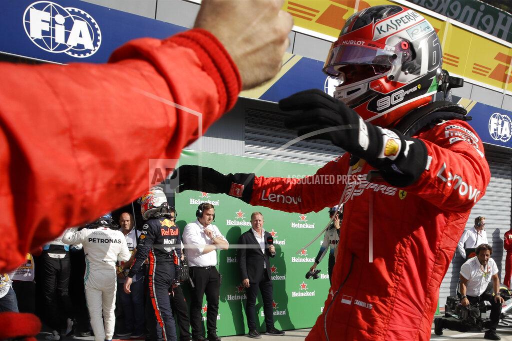 Luca Bruno Ferrari driver Charles Leclerc of Monaco celebrates with his team after winning the Formula One Italy Grand Prix at the Monza racetrack, in Monza, Italy, Sunday, Sept. 8, 2019. (AP Photo/Luca Bruno)