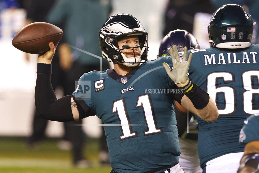 Rich Schultz FILE - Philadelphia Eagles' Carson Wentz (11) passes during an NFL football game against the Seattle Seahawks in Philadelphia, in this Monday, Nov. 30, 2020, file photo. The Philadelphia Eagles have agreed to trade Carson Wentz to the Indianapolis Colts, according to a person familiar with the deal. The person spoke to The Associated Press on condition of anonymity because the deal hasn't been announced. (AP Photo/Rich Schultz, File)