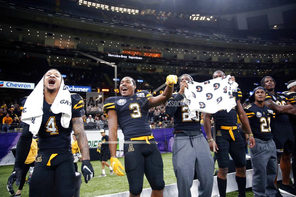 Gerald Herbert Appalachian State players celebrate in the closing minutes of the second half of the New Orleans Bowl NCAA college football game against Middle Tennessee in New Orleans, Saturday, Dec. 15, 2018. Appalachian State won 45-13. (AP Photo/Gerald Herbert)