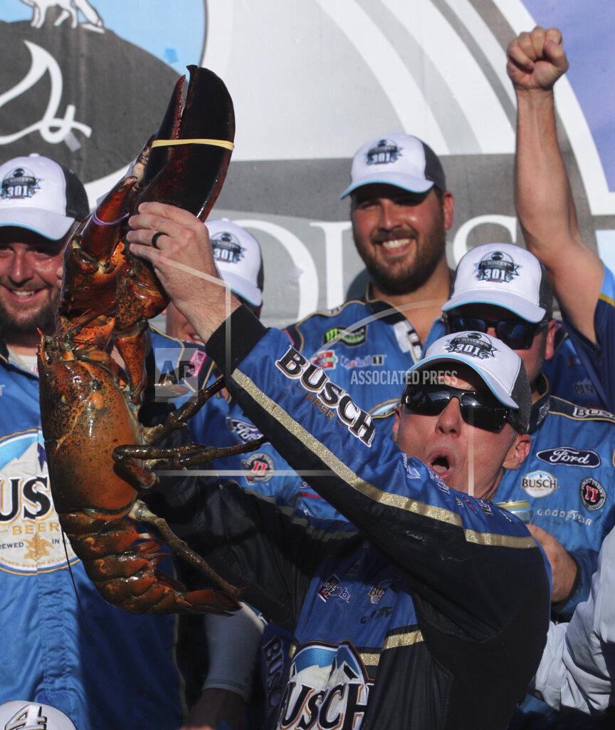 Charles Krupa Kevin Harvick hoists a giant lobster in victory lane after winning a NASCAR Cup Series auto race at New Hampshire Motor Speedway in Loudon, N.H., Sunday, July 21, 2019. (AP Photo/Charles Krupa)