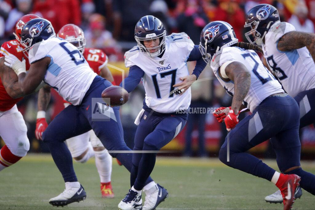 Charlie Riedel FILE - In this Jan. 19, 2020, file photo, Tennessee Titans quarterback Ryan Tannehill (17) looks to hand the ball off during the first half of the AFC championship NFL football game against the Kansas City Chiefs in Kansas City, Mo. The Tennessee Titans are confident enough Ryan Tannehill can repeat the best season of his career, or close enough, that they gave him a four-year, $118 million contract. (AP Photo/Charlie Riedel, File)