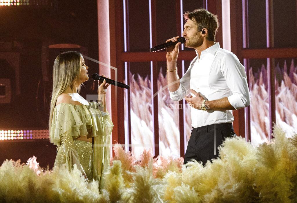 Amy Harris Maren Morris, left, and Ryan Hurd perform at the 56th annual Academy of Country Music Awards on Friday April 16, 2021 at the Ryman Auditorium in Nashville, Tenn. The awards show airs on April 18 with both live and prerecorded segments. (Photo by Amy Harris/Invision/AP)