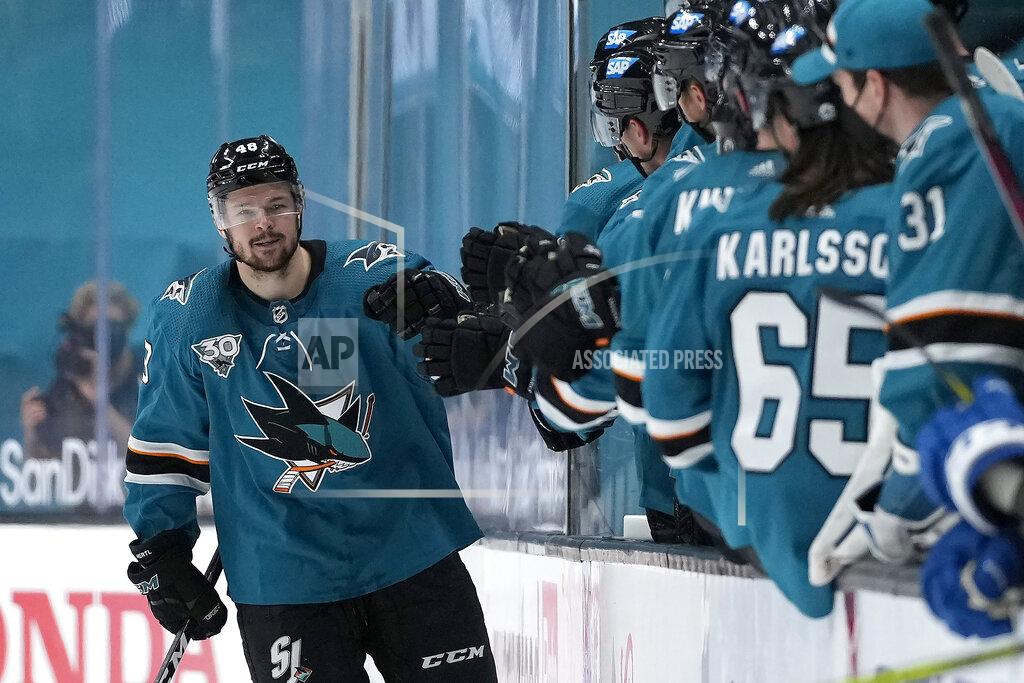 Tony Avelar San Jose Sharks center Tomas Hertl (48) is congratulated by teammates on the bench after scoring a goal against the Colorado Avalanche during the second period of an NHL hockey game in San Jose, Calif., on Wednesday, May 5, 2021. (AP Photo/Tony Avelar)