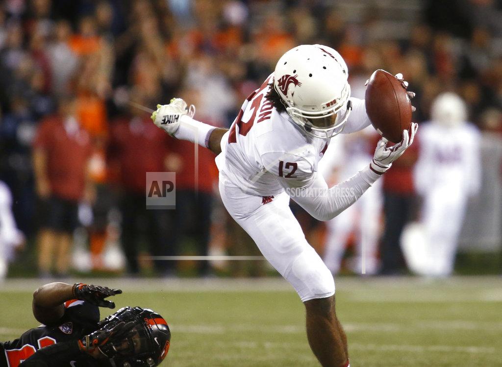 Timothy J. Gonzalez Washington State's Cammon Cooper (2) makes a catch in front of an Oregon State defender during the second half of an NCAA college football in Corvallis, Ore., Saturday, Oct. 6, 2018. (AP Photo/Timothy J. Gonzalez)