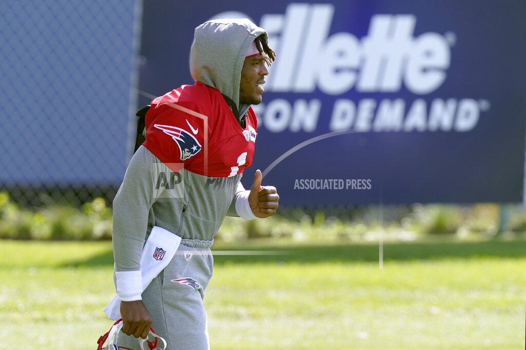 New England Patriots quarterback Cam Newton walks to the field for an NFL football training camp practice, Wednesday, Aug. 26, 2020, in Foxborough, Mass. (AP Photo/Steven Senne, Pool)