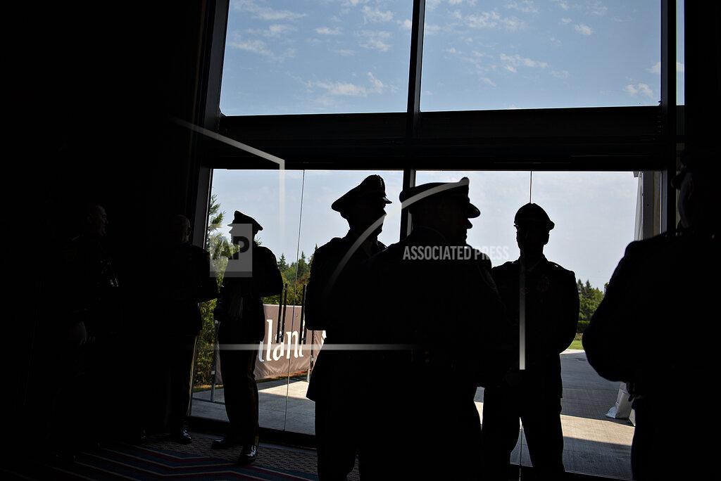 Amanda Cowan Law enforcement officials gather before a memorial service for Clark County Sheriff's Detective Jeremy Brown, who was shot to death July 23 while on duty, Tuesday, Aug. 3, 2021, in La Center, Wash. Hundreds of law enforcement and first responder vehicles lined up earlier in the day for a procession to honor Brown, 46, who was promoted to honorary sergeant after his death. (Amanda Cowan/The Columbian via AP)