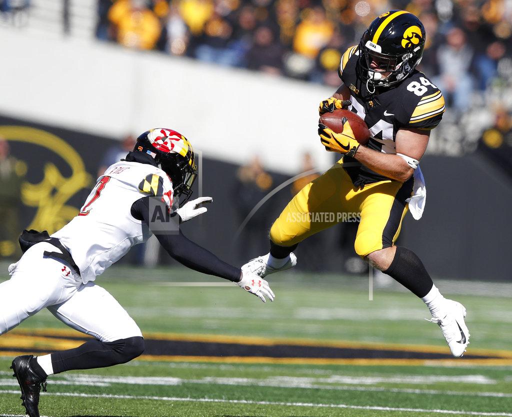 Charlie Neibergall Iowa wide receiver Nick Easley (84) catches a pass in front of Maryland defensive back RaVon Davis, left, during the first half of an NCAA college football game, Saturday, Oct. 20, 2018, in Iowa City, Iowa. (AP Photo/Charlie Neibergall)