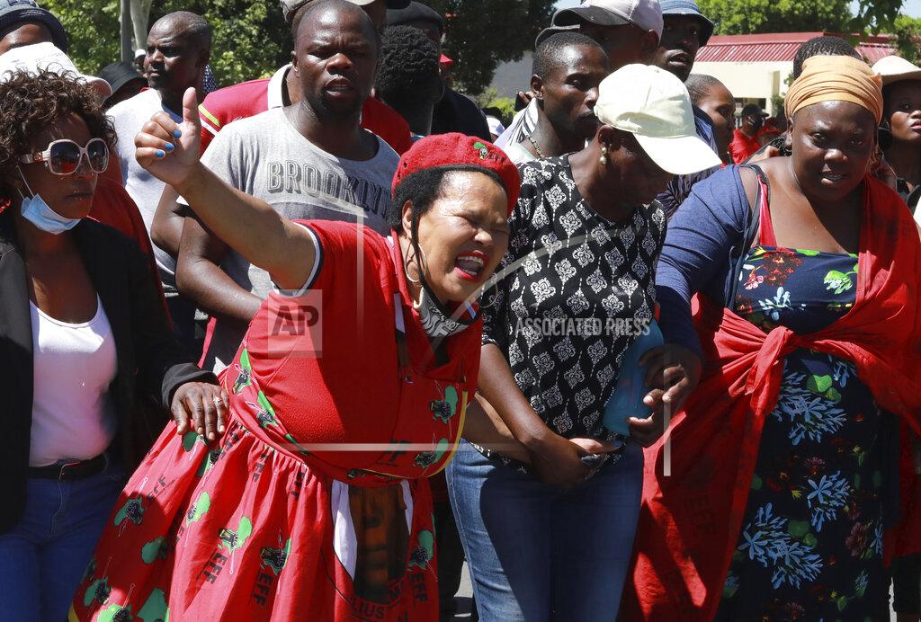 Nardus Engelbrecht Members of the Economic Freedom Fighters (EFF) protest near the Brackenfell High school in Cape Town, South Africa, Friday, Nov. 20, 2020. The EFF party organized protests at the school in response to a students' prom they claim only white kids were invited to. (AP Photo/Nardus Engelbrecht)