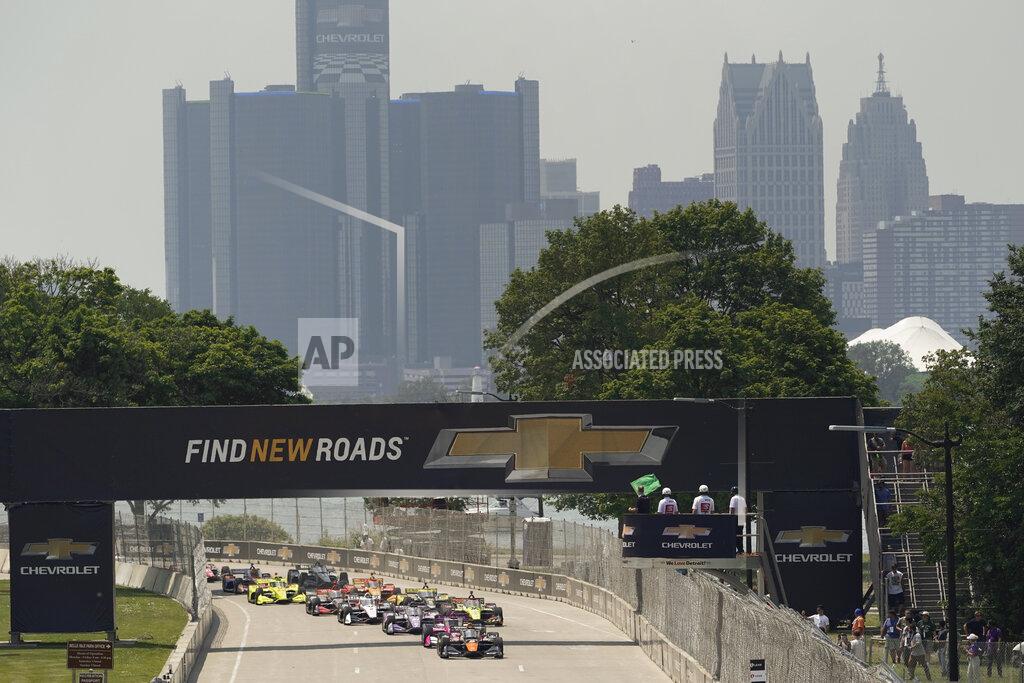 Paul Sancya Pole sitter Pato O'Ward leads the field to the start line during the first race of the IndyCar Detroit Grand Prix auto racing doubleheader on Belle Isle in Detroit Saturday, June 12, 2021. (AP Photo/Paul Sancya)