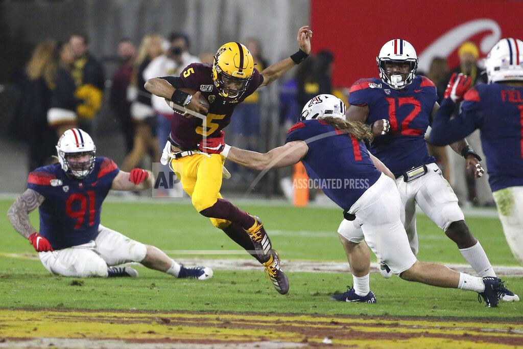 Darryl Webb Arizona State's Jayden Daniels (5) runs against Arizona's defense during the first half of an NCAA college football game, Saturday, Nov. 30, 2019, in Tempe, Ariz. (AP Photo/Darryl Webb)