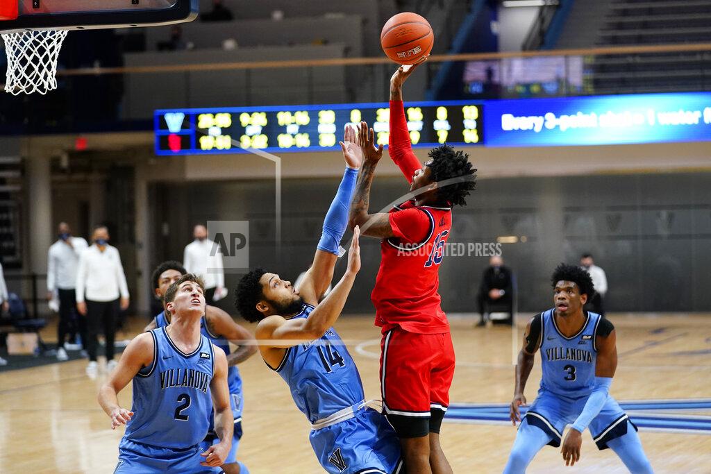 Matt Slocum St. John's Vince Cole (15) goes up for a shot against Villanova's Caleb Daniels (14) during the second half of an NCAA college basketball game, Tuesday, Feb. 23, 2021, in Villanova, Pa. (AP Photo/Matt Slocum)