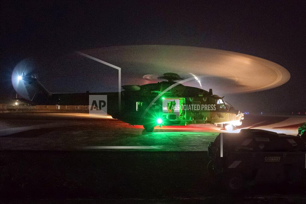 Uncredited A French Barkhane force Caiman transport helicopter lands following a night mission in Gao, Mali, Monday June 7, 2021. France has suspended joint military operations with Malian forces until the junta led by Col. Assimi Goita, who retook control of Mali's transitional government May 24, complies with international demands to restore civilian rule. (AP Photo/Jerome Delay)
