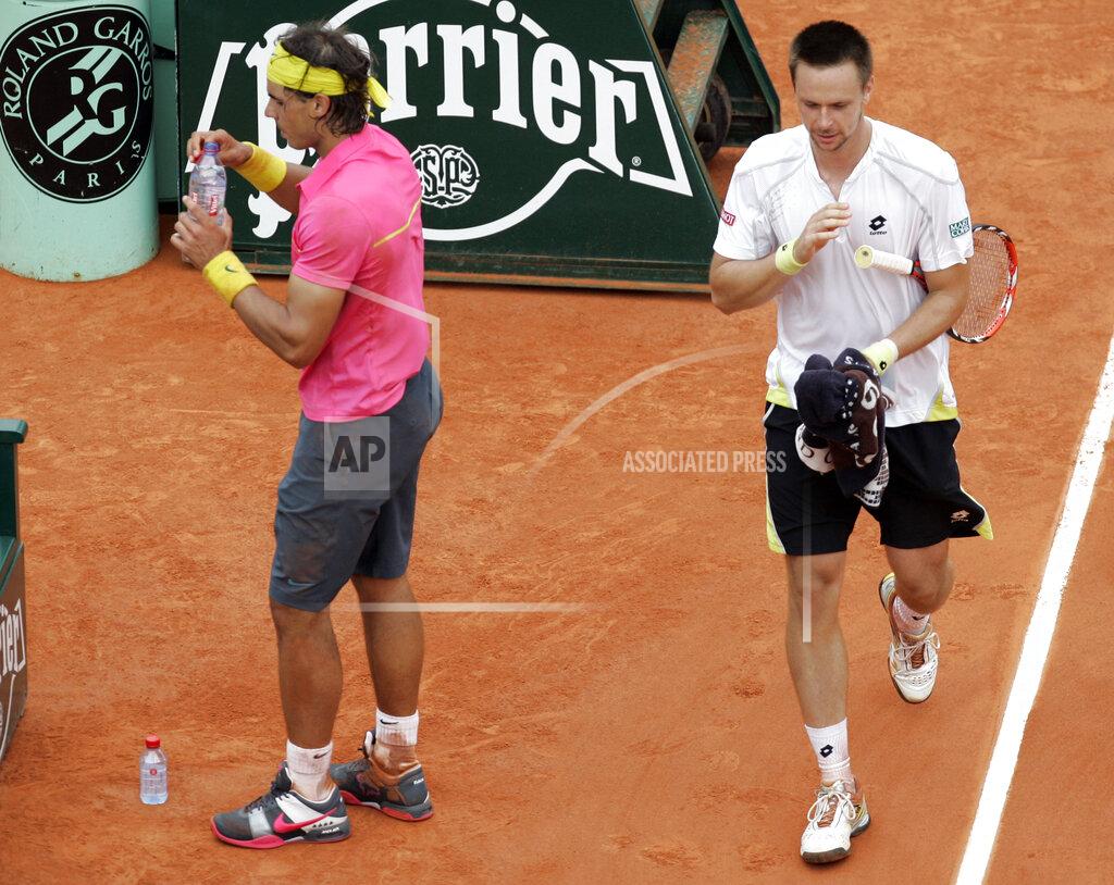 Christophe Ena FILE - In this May 31, 2009, file photo, Sweden's Robin Soderling, right, and defending champion Spain's Rafael Nadal walk back to their seats during their fourth round match of the French Open tennis tournament at the Roland Garros stadium in Paris. Soderling won 6-2, 6-7 (2), 6-4, 7-6 (2). It wasn't just that Nadal was unbeaten through 31 matches at the French Open and considered a lock to become the first man with five consecutive titles there. It's also that Soderling never had been past the second round at any major.(AP Photo/Christophe Ena, File)