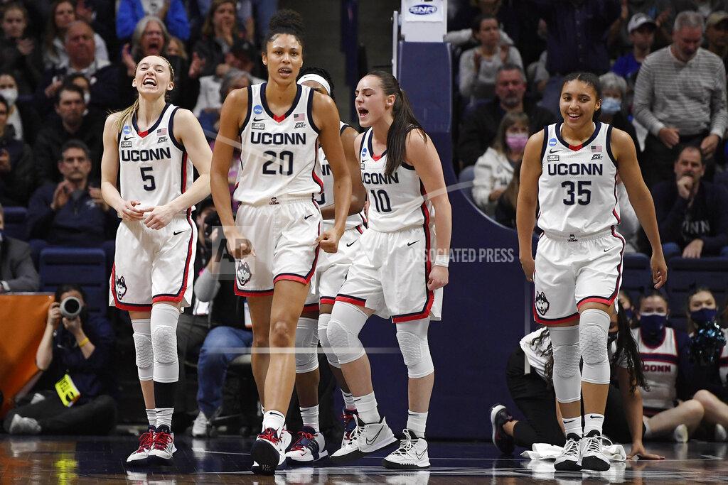 Jessica Hill From left to right, Connecticut's Paige Bueckers, Olivia Nelson-Ododa, Nika Muhl and Azzi Fudd react during the first half of a second-round women's college basketball game against Central Florida in the NCAA tournament, Monday, March 21, 2022, in Storrs, Conn. (AP Photo/Jessica Hill)