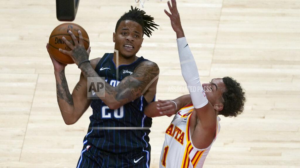 John Bazemore Orlando Magic guard Markelle Fultz (20) pulls in a rebound next to Atlanta Hawks guard Trae Young (11) during the second half of an NBA preseason basketball game Friday, Dec. 11, 2020, in Atlanta. (AP Photo/John Bazemore)