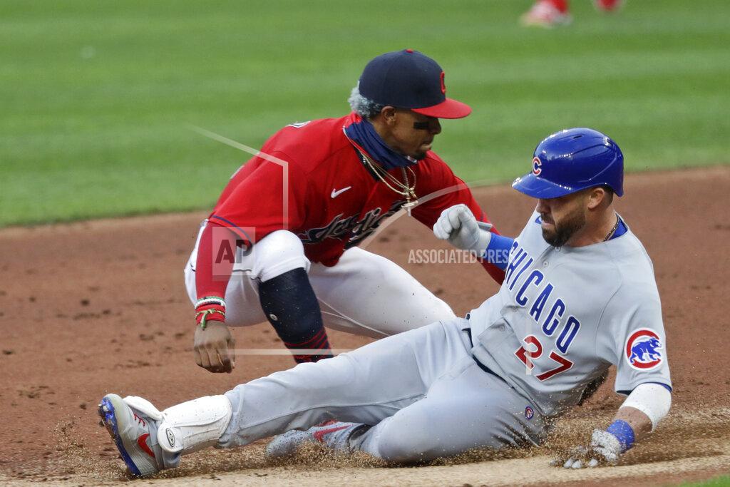 Tony Dejak Chicago Cubs' Jason Kipnis, right, slides safely into second base for a double as Cleveland Indians' Francisco Lindor is late with the tag in the third inning in a baseball game, Tuesday, Aug. 11, 2020, in Cleveland. (AP Photo/Tony Dejak)