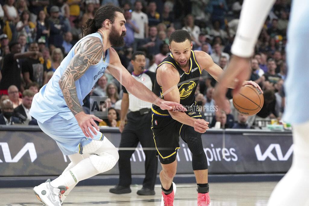 Karen Pulfer Focht Memphis Grizzlies' Steven Adams (4) defends Golden State Warriors' Stephen Curry (30) in the first half of Game 5 of an NBA basketball second-round playoff series Wednesday, May 11, 2022, in Memphis, Tenn. (AP Photo/Karen Pulfer Focht)
