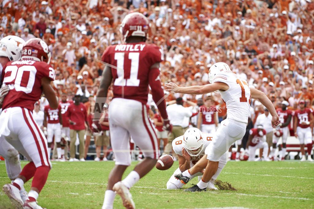 Cooper Neill Texas kicker Cameron Dicker (17) kicks the game-winning field goal in the closing seconds of the second half of an NCAA college football game against Oklahoma at the Cotton Bowl, Saturday, Oct. 6, 2018, in Dallas. Texas won 48-45. (AP Photo/Cooper Neill)
