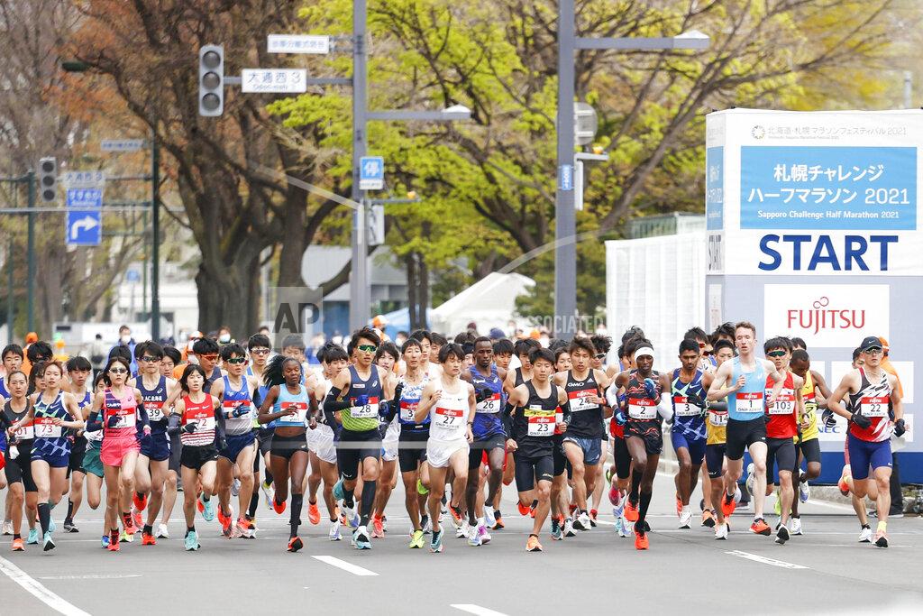Masanori Takei Runners start at the Sapporo challenge half-marathon held as a Tokyo 2020 Olympics test event in Sapporo, northern Japan, Wednesday, May 5, 2021. (Masanori Takei/Kyodo News via AP)