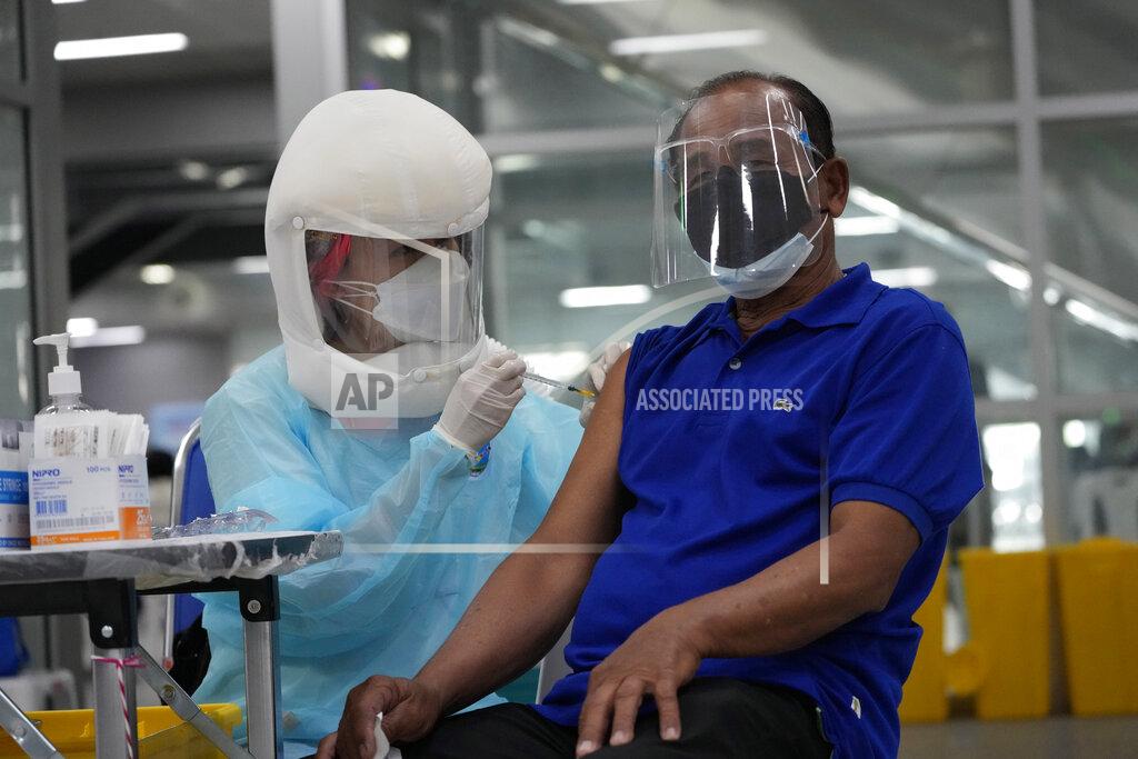 Sakchai Lalit A health worker administers shots of the AstraZeneca COVID-19 vaccine at the Central Vaccination Center in Bangkok, Thailand, Thursday, July 22, 2021. (AP Photo/Sakchai Lalit)