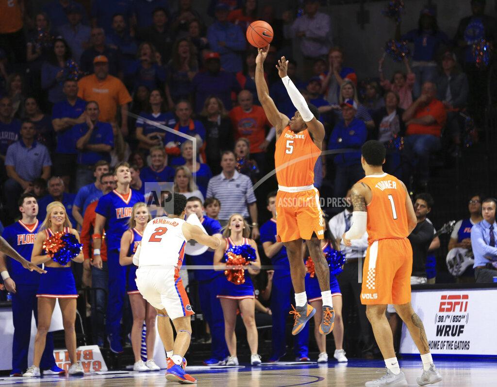Matt Stamey Tennessee guard Admiral Schofield (5) makes a 3-pointer over Florida guard Andrew Nembhard (2) in the final minute of an NCAA college basketball game Saturday, Jan. 12, 2019, in Gainesville, Fla. (AP Photo/Matt Stamey)