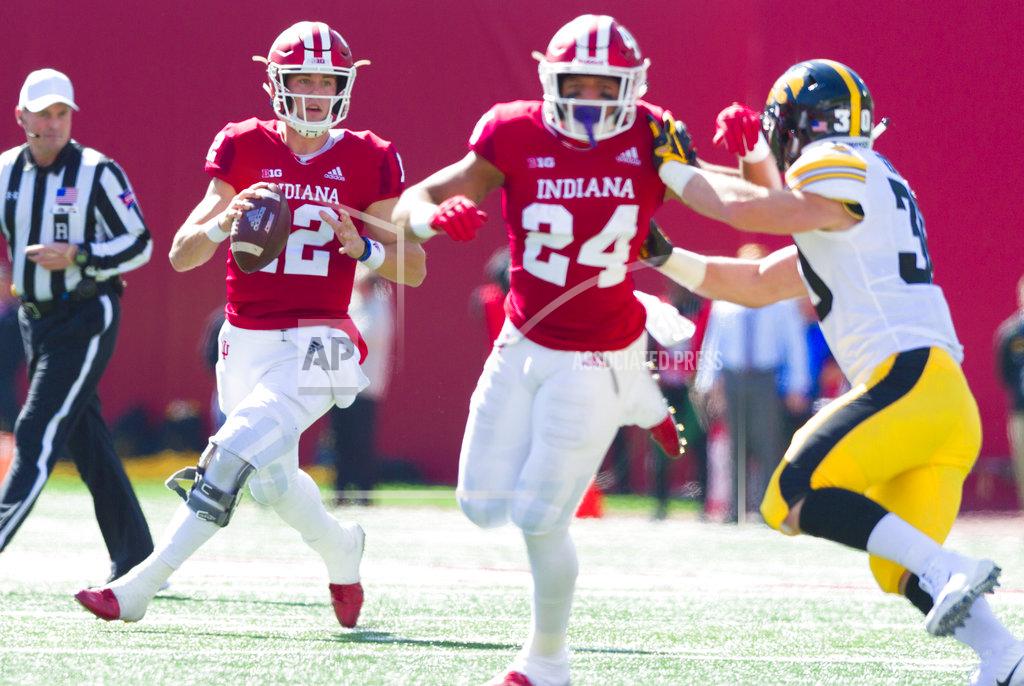 Doug Mcschooler Indiana Hoosiers quarterback Peyton Ramsey (12) looks up field for an open receiver during the first half of an NCAA college football game against Iowa, Saturday, Oct. 13, 2018, in Bloomington, Ind. (AP Photo/Doug McSchooler)