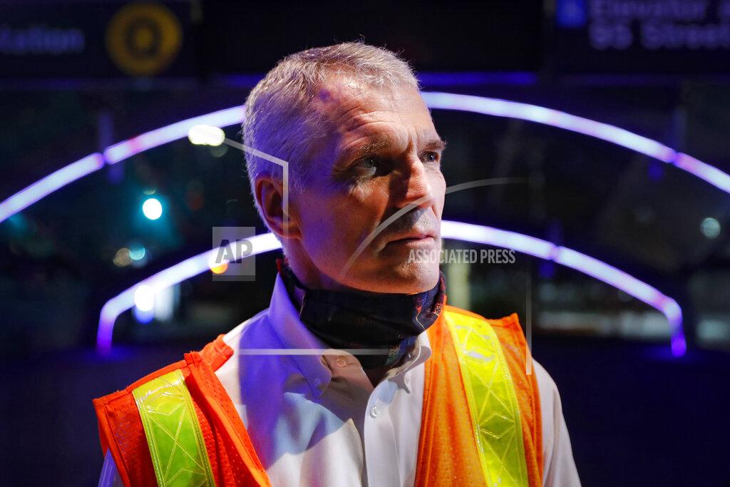 John Minchillo Patrick Warren, the MTA’s chief safety officer, stands outside the 96th Street station as contractors below clean subway cars to control the spread of COVID-19, Thursday, July 2, 2020, in New York. Warren said the authority's aggressive cleaning and disinfecting began at a time when health officials were warning that the virus could easily be transmitted from hard surfaces — guidance that has since evolved to place more emphasis on airborne transmission. (AP Photo/John Minchillo)