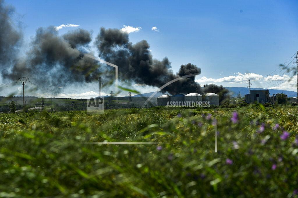 Alvaro Barrientos Black smoke billows from a biodiesel production plant in Calahorra, northern Spain, Thursday, May 26, 2022. Police in Spain say an explosion at a biodiesel plant has left two people dead and forced 250 children to be evacuated from the area. (AP Photo/Alvaro Barrientos)