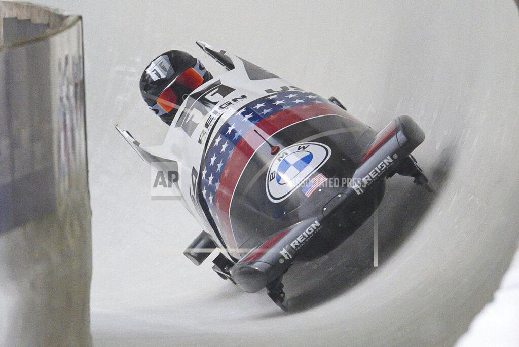 Robert Michael Canada's Kaillie Humphries, competing for the United States, speeds down the track in the women's monobob race at the world cup in Altenberg, Germany, Saturday, Dec.4, 2021. (Robert Michael/dpa via AP)