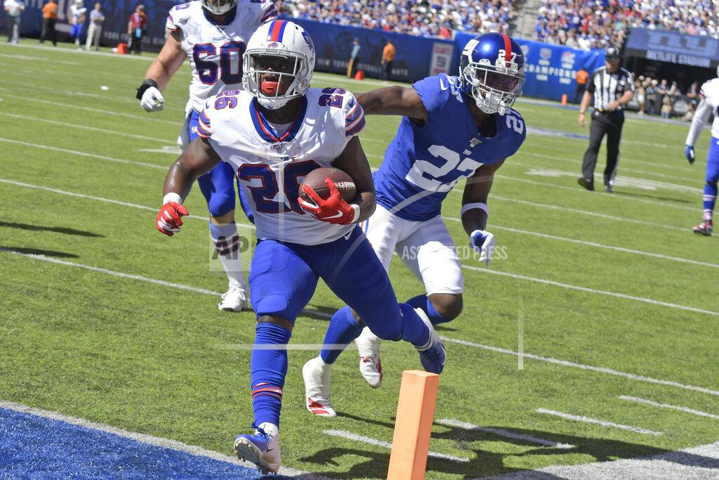 Bill Kostroun Buffalo Bills running back Devin Singletary (26), left, scores a touchdown during the first half of an NFL football game against the New York Giants, Sunday, Sept. 15, 2019, in East Rutherford, N.J. (AP Photo/Bill Kostroun)