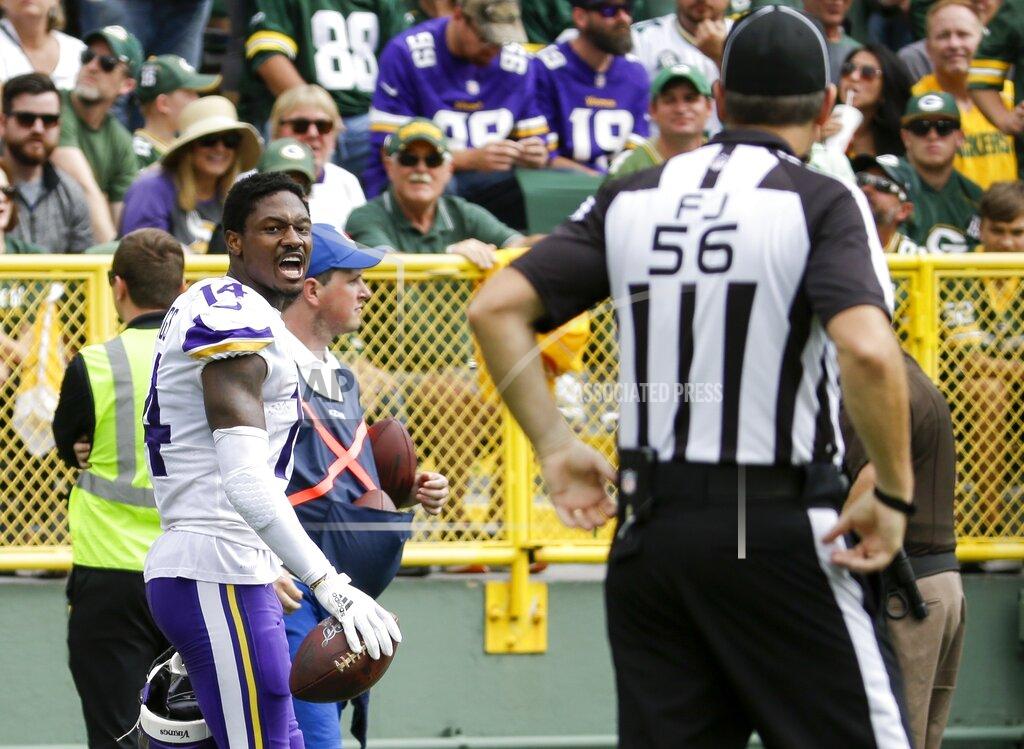 Mike Roemer Minnesota Vikings' Stefon Diggs reacts after being called for a penalty for removing his helmet during the second half of an NFL football game against the Green Bay Packers Sunday, Sept. 15, 2019, in Green Bay, Wis. (AP Photo/Mike Roemer)