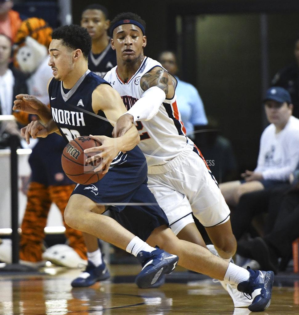 Julie Bennett Auburn guard Bryce Brown (2) fouls North Florida guard Brian Coffey II (20) during the first half of an NCAA college basketball game Saturday, Dec. 29, 2018, in Auburn, Ala. (AP Photo/Julie Bennett)