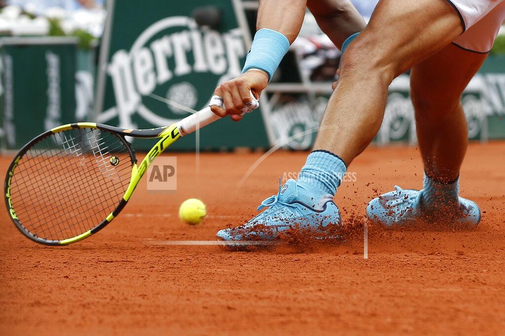 Alastair Grant FILE- In this Thursday, May 26, 2016, image Spain's Rafael Nadal runs and slides to return a shot in his second round match of the French Open tennis tournament against Argentina's Facundo Bagnis at the Roland Garros stadium in Paris, France. The skill of sliding at Roland Garros is on hold at the moment with the start of the French Open postponed until September because of the coronavirus, but sliding will still be one of the keys to success at the French Open whenever it is played. (AP Photo/Alastair Grant, File)