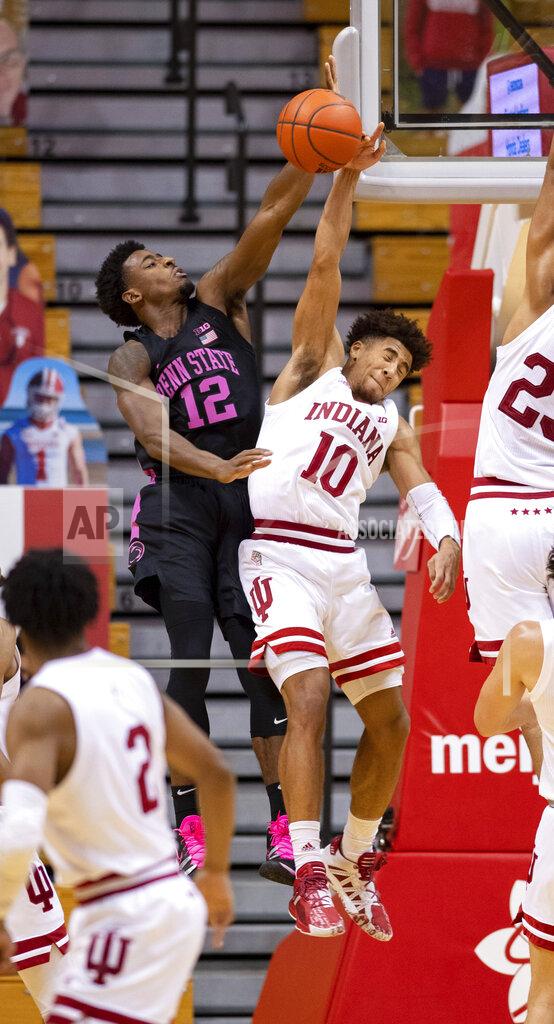 Doug Mcschooler Indiana guard Rob Phinisee (10) blocks a shot by Penn State guard Izaiah Brockington (12) during the second half of an NCAA college basketball game, Wednesday, Dec. 30, 2020, in Bloomington, Ind. Indiana won 87-85 in overtime. (AP Photo/Doug McSchooler)