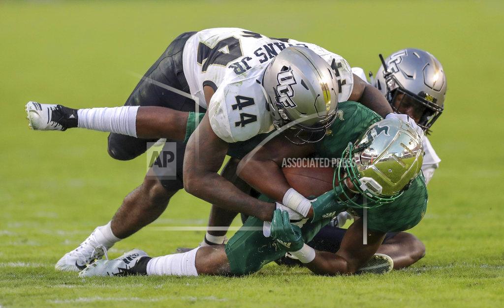 Mike Carlson Central Florida's Nate Evans (44) tackles South Florida's Stanley Clerveaux during the second half of an NCAA college football game Friday, Nov. 23, 2018, in Tampa, Fla. (AP Photo/Mike Carlson)