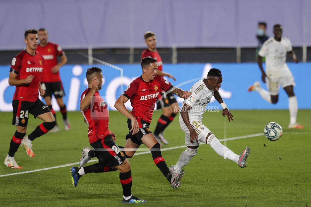 Bernat Armangue Real Madrid's Vinicius Junior, second right, kicks the ball during the Spanish La Liga soccer match between Real Madrid and Mallorca at Alfredo di Stefano stadium in Madrid, Spain, Wednesday, June 24, 2020. (AP Photo/Bernat Armangue)