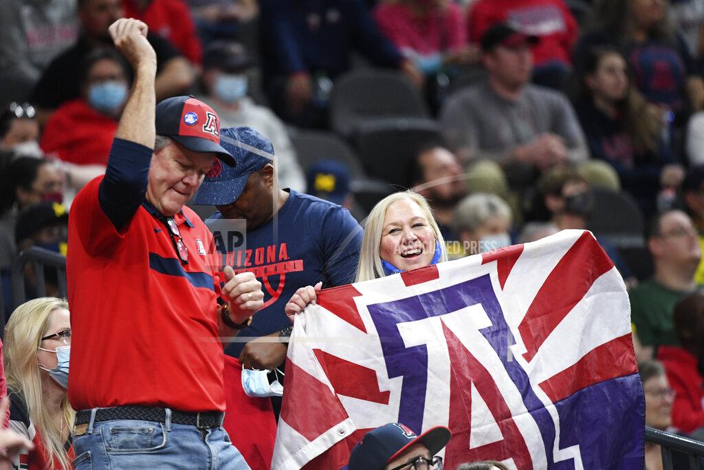 Sam Morris Arizona fans cheer on their team during an NCAA college basketball game against Michigan Sunday, Nov. 21, 2021, in Las Vegas. (AP Photo/Sam Morris)