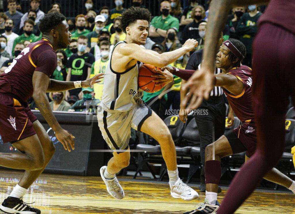 Thomas Boyd Oregon guard Will Richardson (0) drives to the basket against Arizona State during an NCAA college basketball game in Eugene, Ore., Sunday, Dec. 5, 2021. (AP Photo/Thomas Boyd)