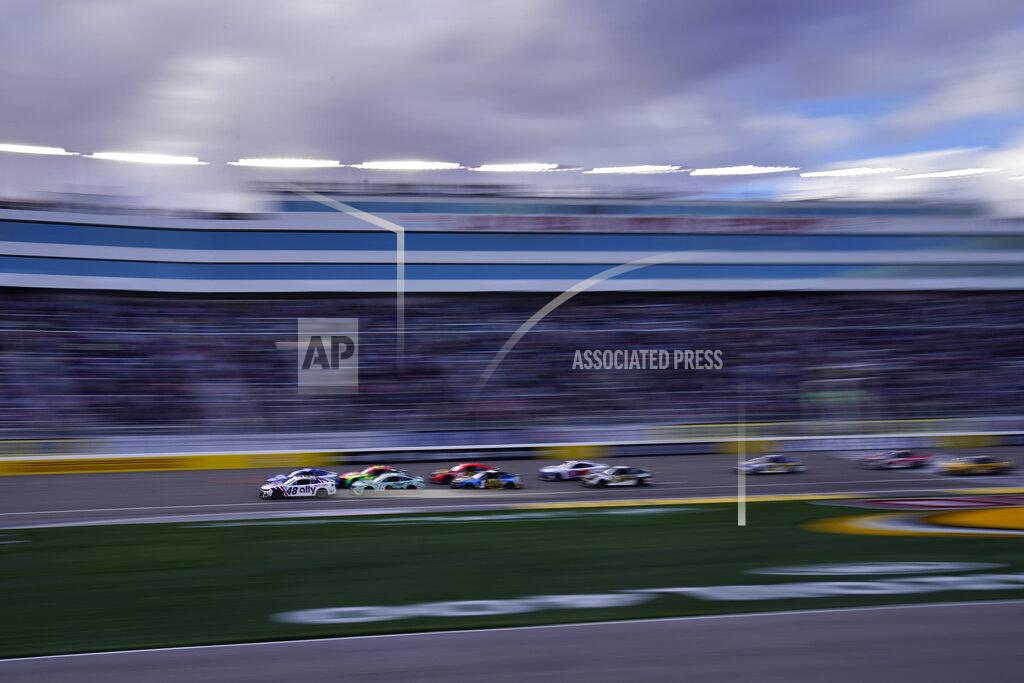 John Locher Alex Bowman (48) leads in the final laps during a NASCAR Cup Series auto race Sunday, March 6, 2022, in Las Vegas. (AP Photo/John Locher)